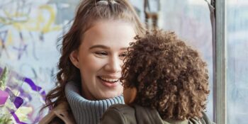 mom smiling at child