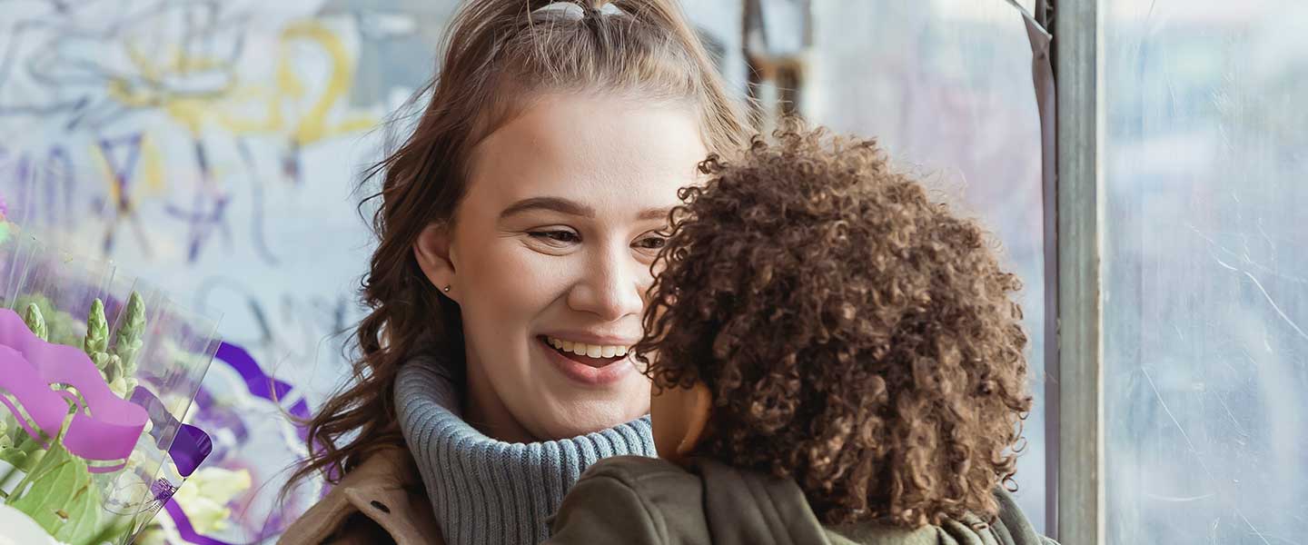 mom smiling at child